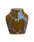Collier noeud doré Nina Ricci