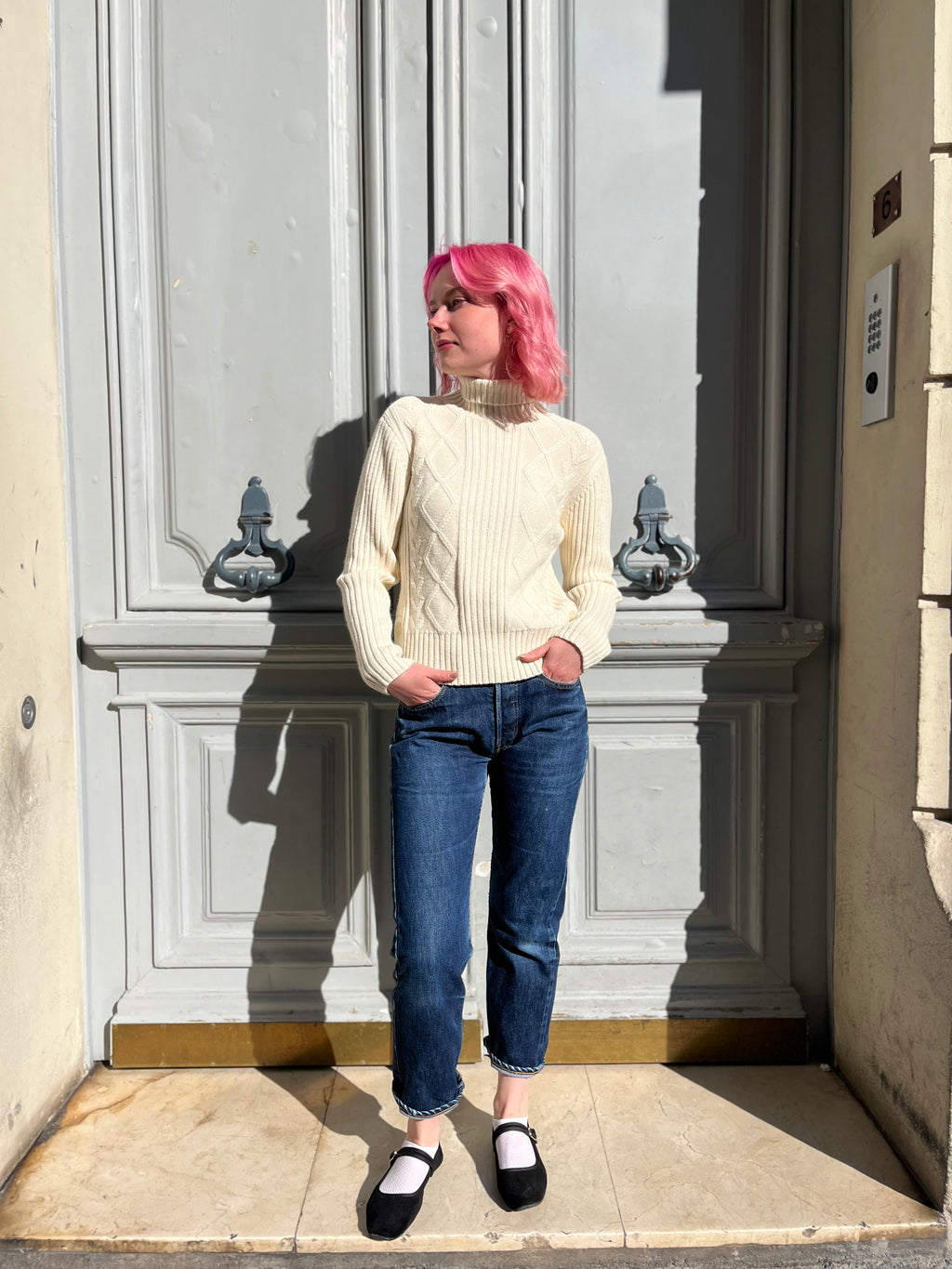 Pull écru en maille torsadée