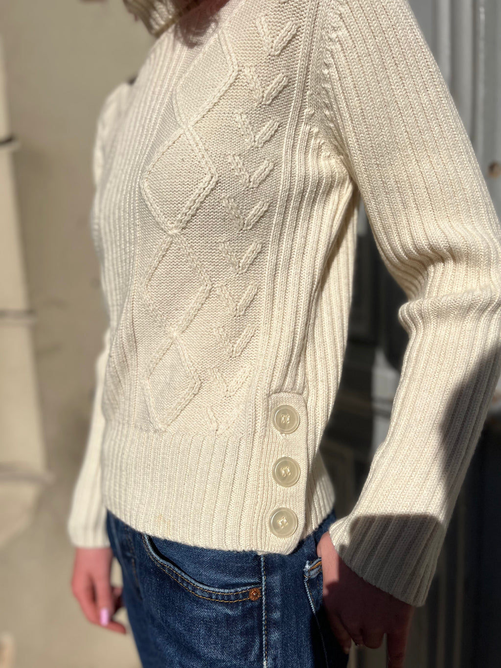 Pull écru en maille torsadée