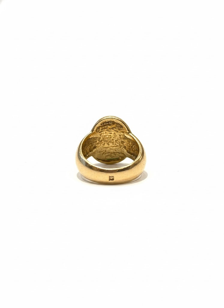 Bague dorée à pierre verte