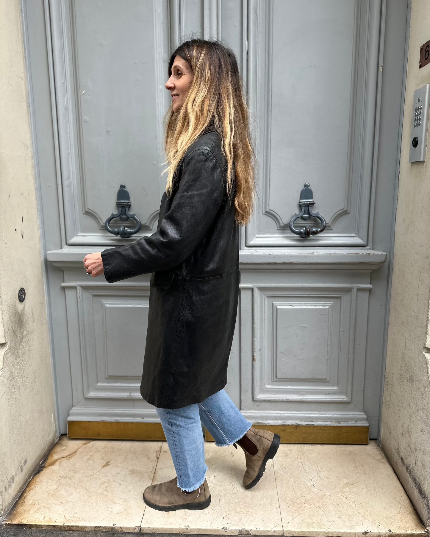 Manteau mi-long noir en cuir