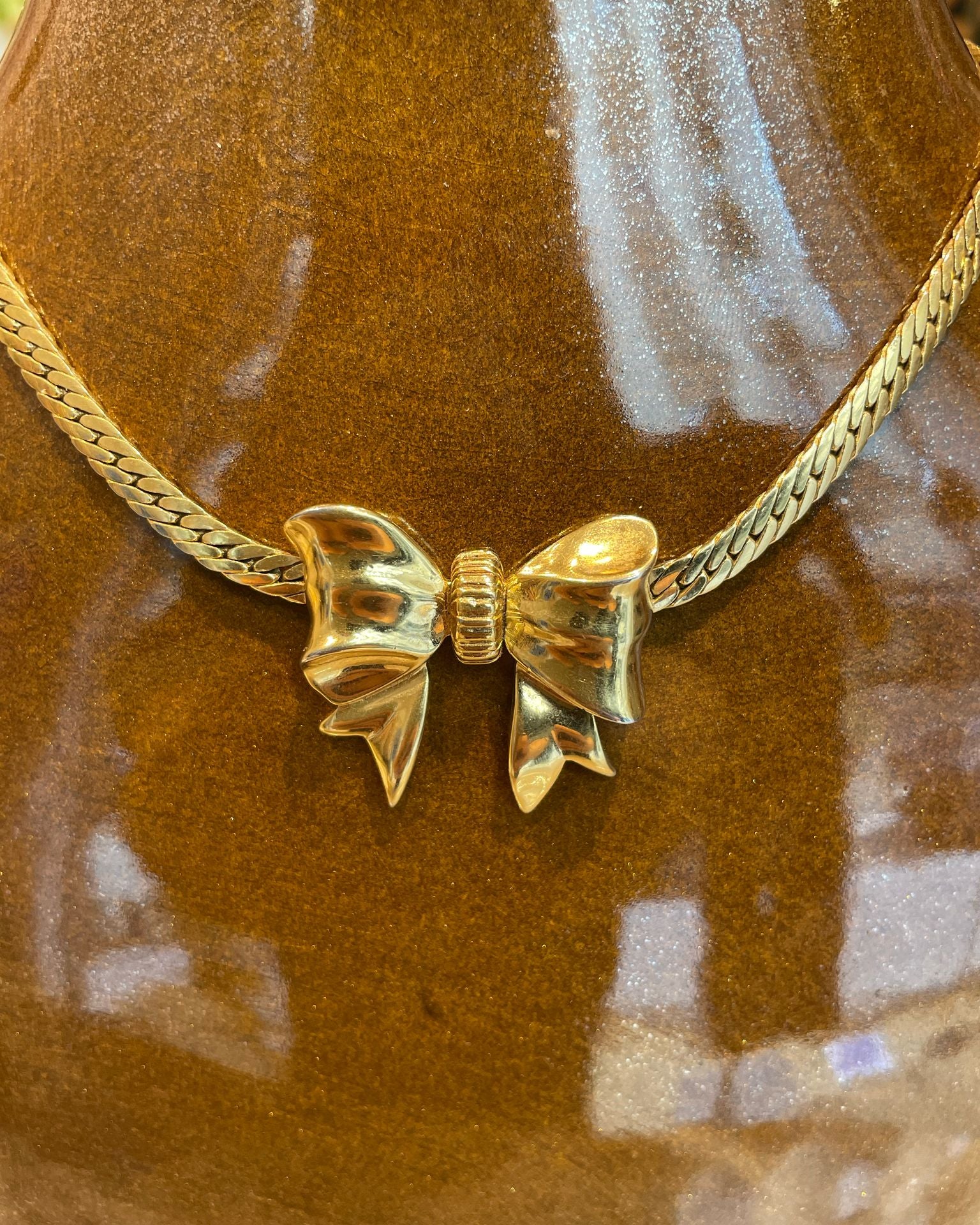 Collier noeud doré Nina Ricci