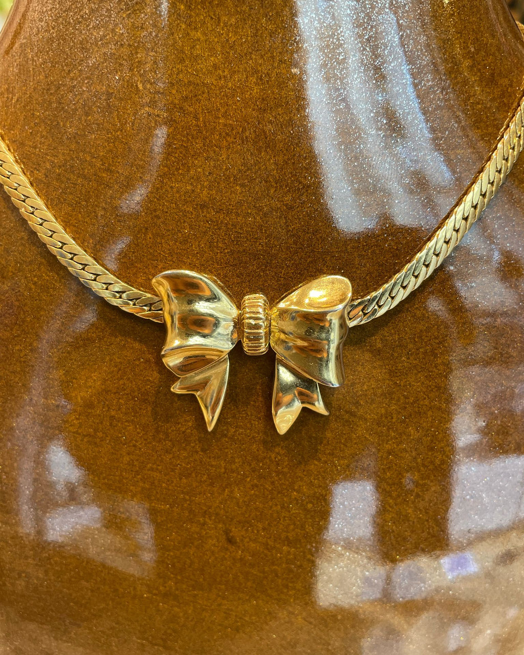 Collier noeud doré Nina Ricci
